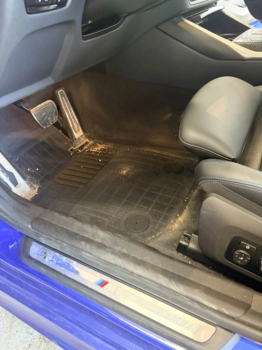 Vehicle footwell before interior detailing — heavy dirt and staining